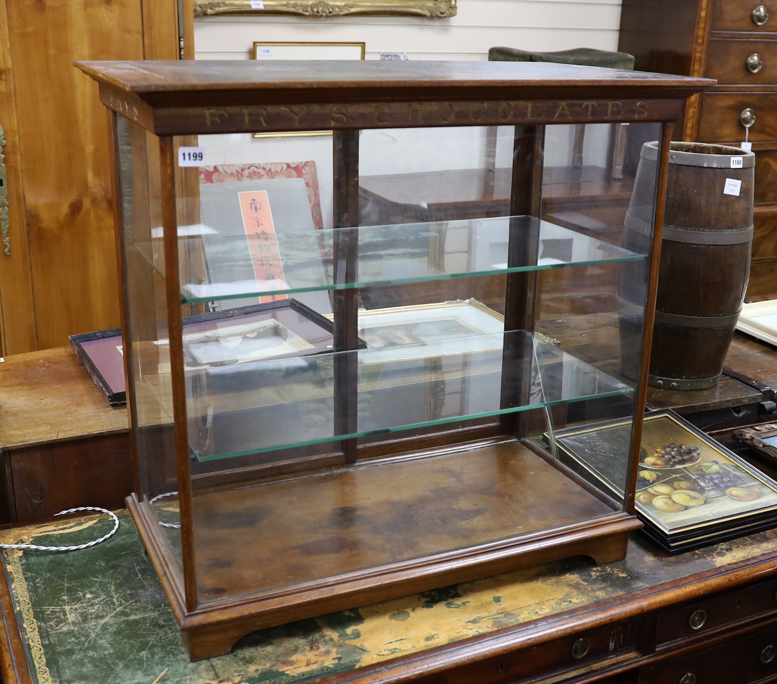 A late Victorian / Edwardian mahogany Fry’s Chocolates counter shop display cabinet with gilded lettering, width 81cms, depth 47cms, height 77cms.